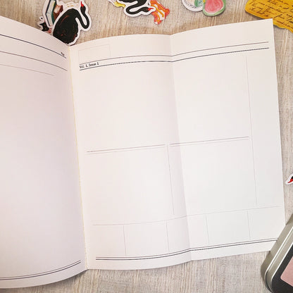 An open planner or notebook with an unfold blank lined pages, photographed from above on a light wood surface with small decorative stickers around the edges.